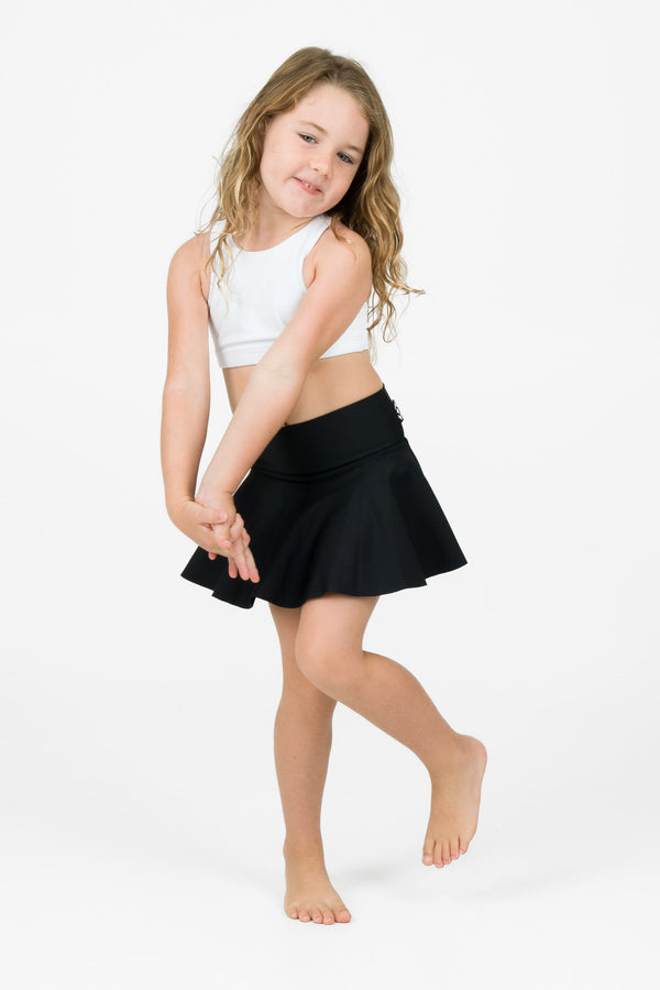 Young girl wearing exotica activewear designed for performance dancing simple skort design full coverage in black colour