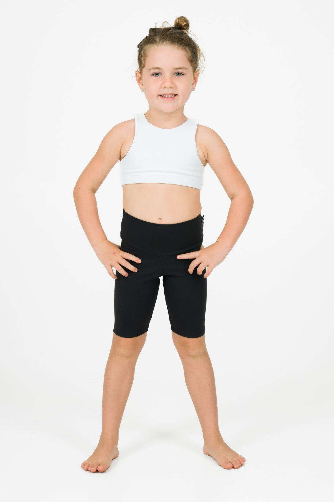 Young kid wearing black sport shorts athleticwear for kids 