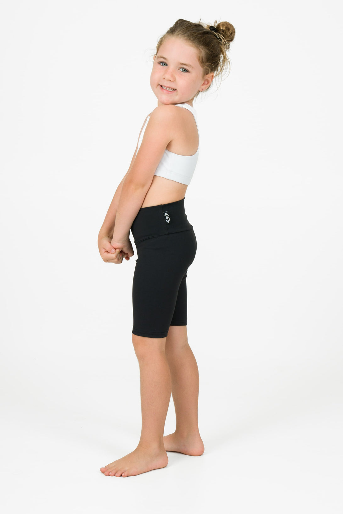 Young kid wearing black sport shorts athleticwear for kids