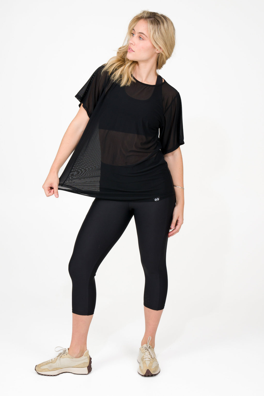woman wearing black net mesh tshirt athletic activewear