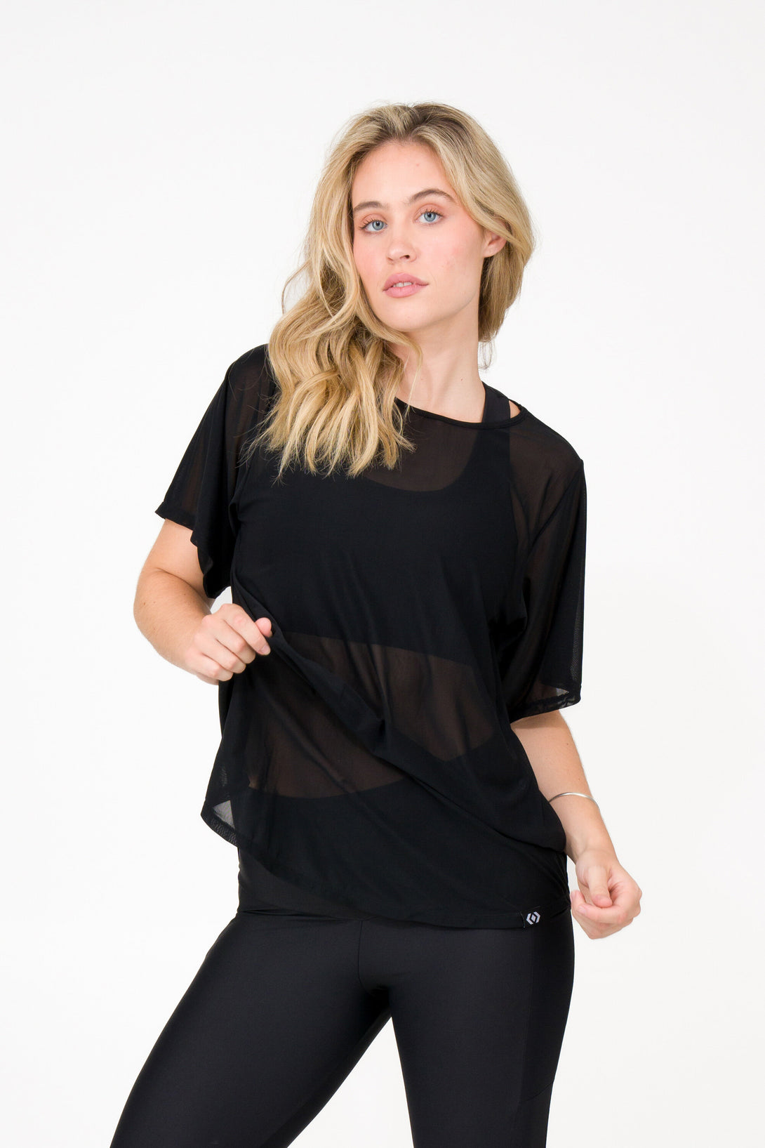 woman wearing black net mesh tshirt athletic activewear